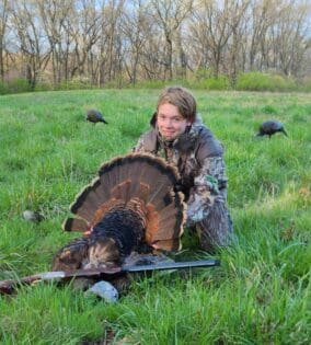 Happy Youth Turkey Hunter With Harvested Jake