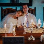 Bride and groom posing at the Sunset Valley Lodge dining hall.