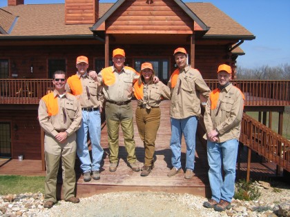 Wingshooters standing in front of Heartland Lodge