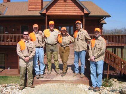 Wingshooters standing in front of Heartland Lodge