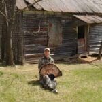 Posing in front of the original house on the family farm.