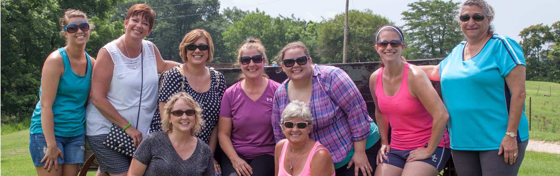 Girls Getaway Group in Front of Wagon