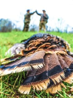 two hunters congratulating after a successful hunt