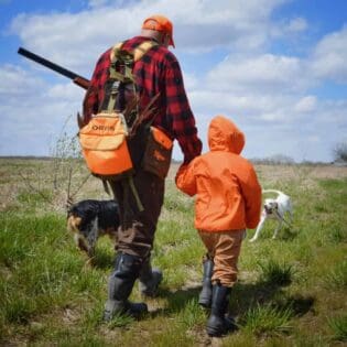 Grandpa taking his grandkid upland hunting