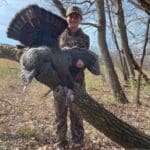 Youth hunter holding up her first gobbler!