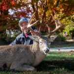 Trophy hunter posing with his big buck